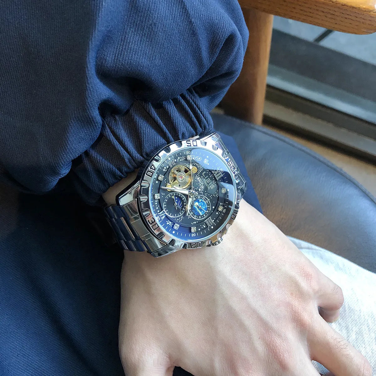 Silver case automatic mechanical watch with black dial, genuine leather strap, and stainless steel buckle