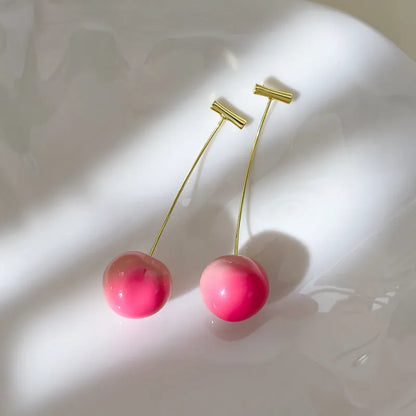 Acrylic peach-shaped earrings with copper posts in small and large size options