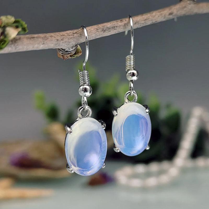 Opal earrings with retro moonstone eardrop design and cross motif, featuring electroplated alloy construction in a drop shape with ellipse elements for a simple style.