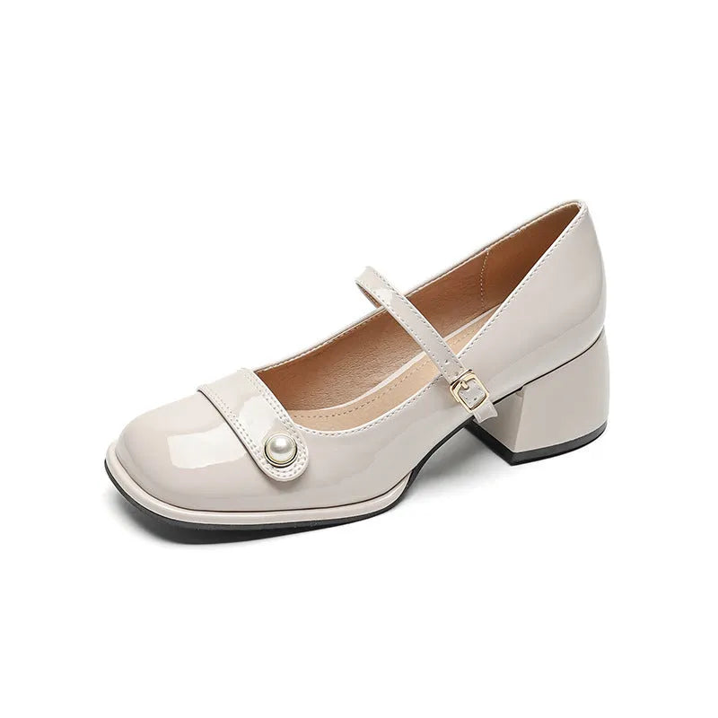 Women's apricot patent leather chunky heel ankle strap pumps with a square toe on a white background