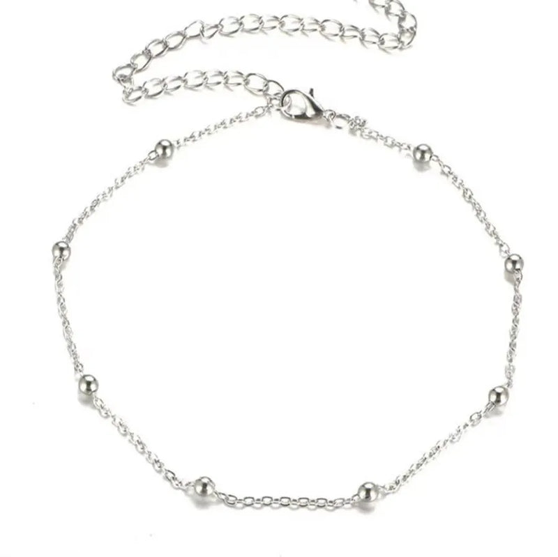 Bohemian anklet for women with electroplated gold or silver finish and twisted chain style featuring geometric pendant charms, adjustable summer beach foot jewellery accessory