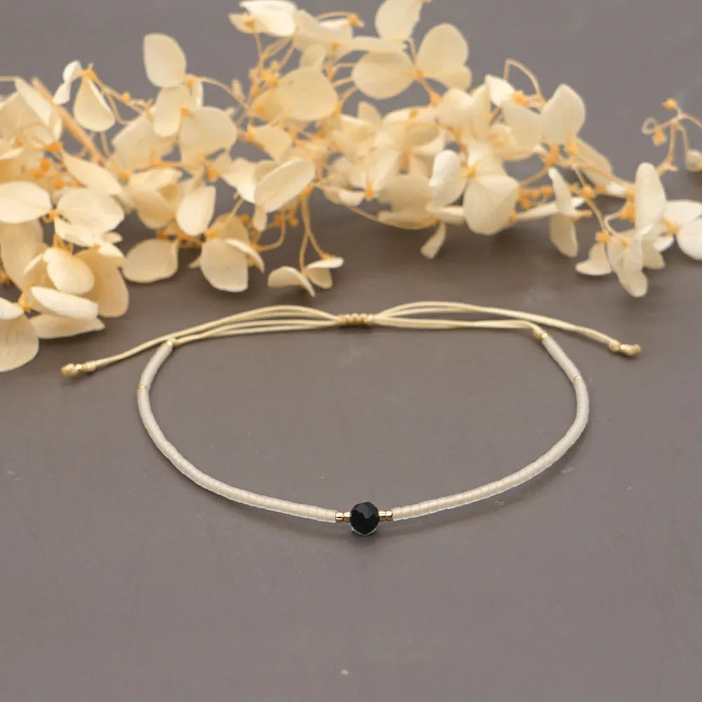 Handmade women's bracelet with colourful geometric glass and coloured glaze beads in Bohemian style.