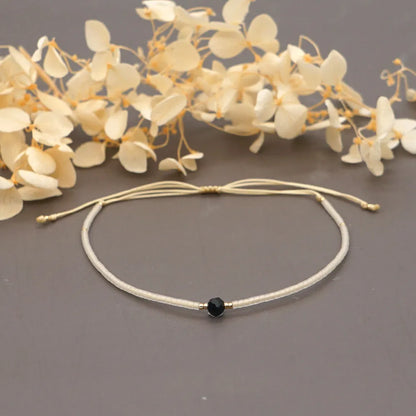 Handmade women's bracelet with colourful geometric glass and coloured glaze beads in Bohemian style.