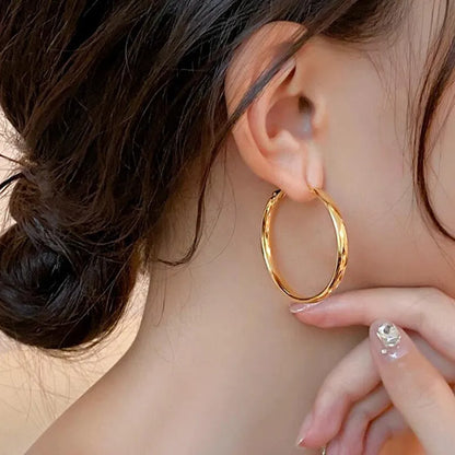Gold and silver tone 40mm metal circle earrings with electroplated finish