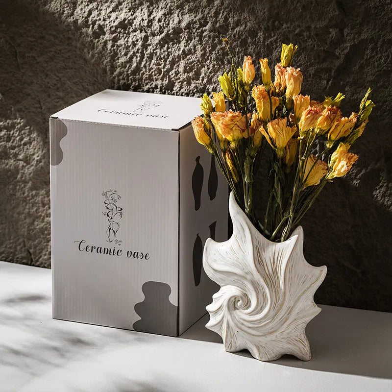 French art ceramic vase with coloured glaze in a European retro style, shown empty on a wooden surface.
