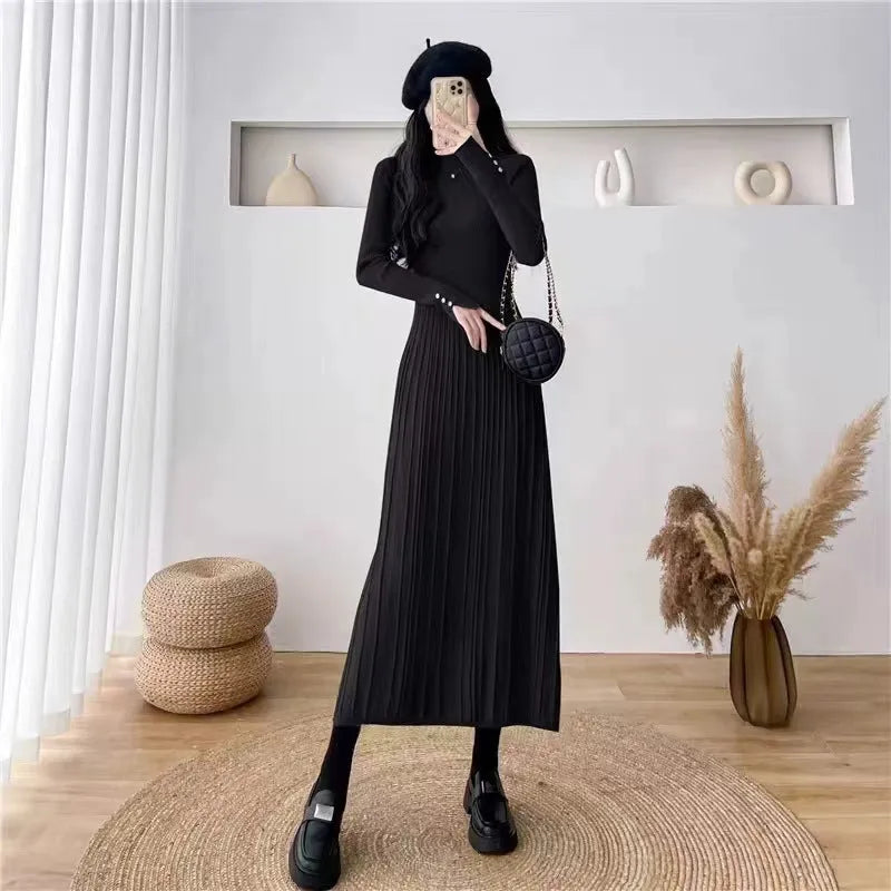 Women's high waist A-line knit skirt in a solid colour, knee-length midi style.