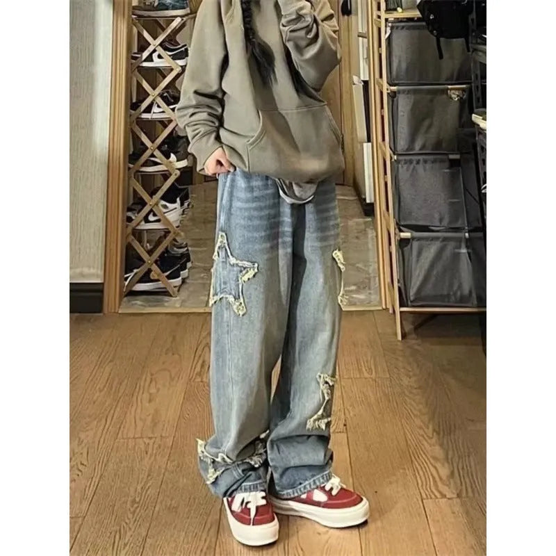 Blue high-waisted straight-leg women's jeans on a hanger, showing the waistband and leg cut.