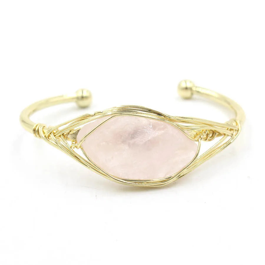 Natural raw gemstone bracelet with 8mm rough crystal beads in ethnic style, shown on wrist.