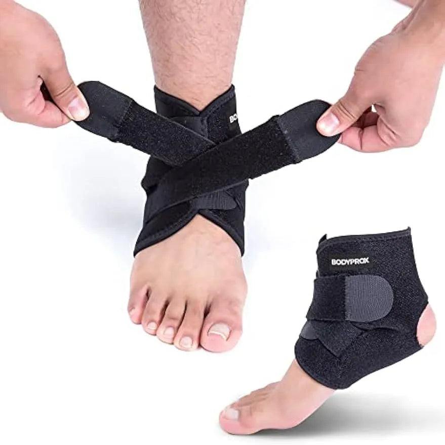 A single black sports ankle support laid flat, designed for injury protection during various athletic activities.