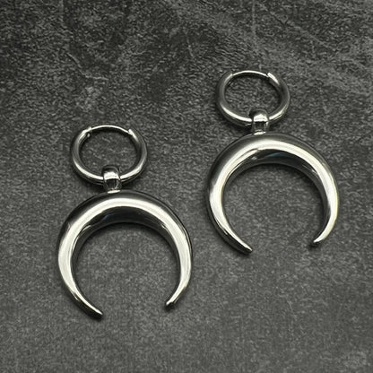 Silver big hoop earrings with a gothic moon and geometric punk design, ear clip style.