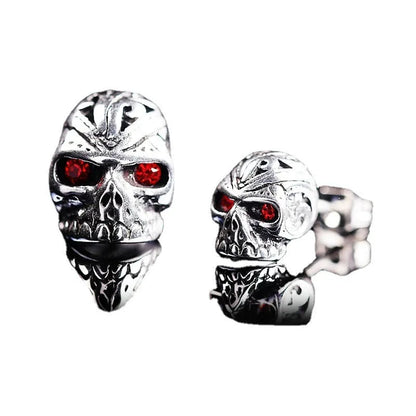 Red eye skull stud earrings with electroplated alloy construction and gemstone accents