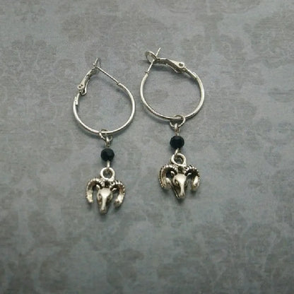 Silver round ring earrings with 2.5 cm diameter on display