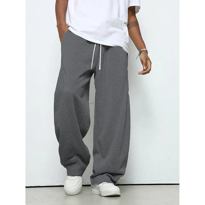 Men's solid colour casual trousers with a straight leg and elastic drawstring waist.