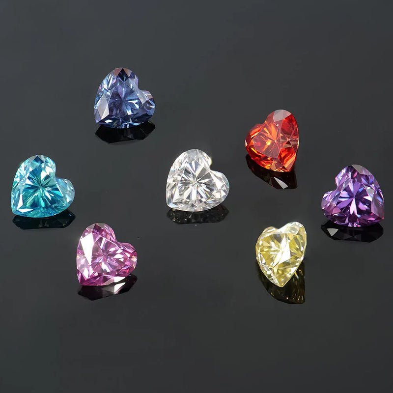 Heart-shaped moissanite stones in colourful shades including lemon yellow, pomegranate red, and sapphire blue, available in multiple sizes from 4x4mm 0.3ct to 11x11mm 5ct for jewellery making and gemstone crafting projects