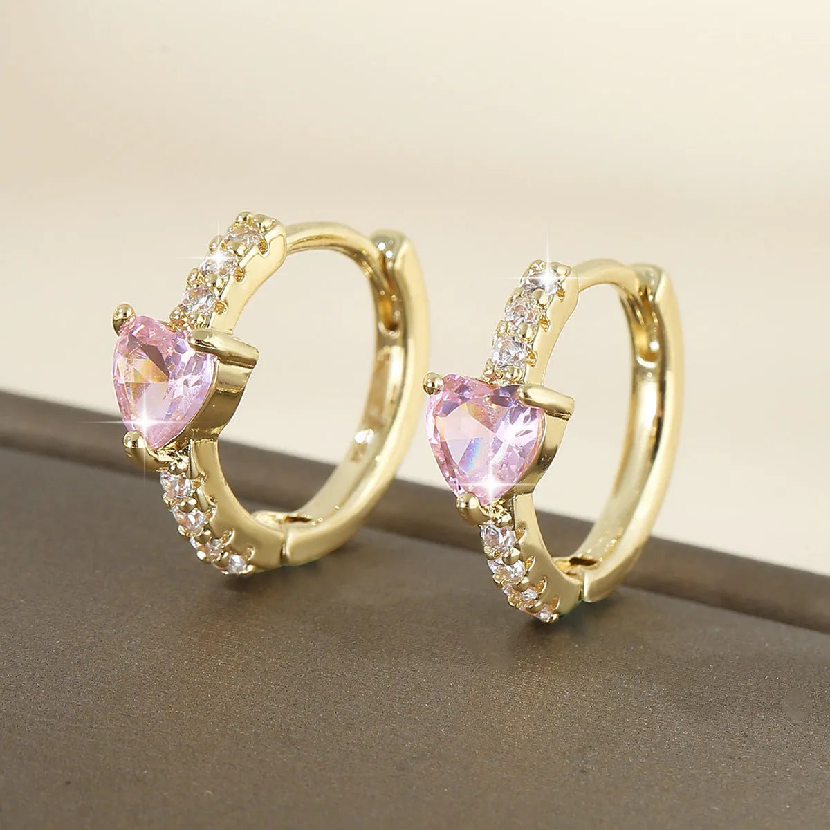 Round love heart copper clip-on earrings in pink, white, and green with geometric design