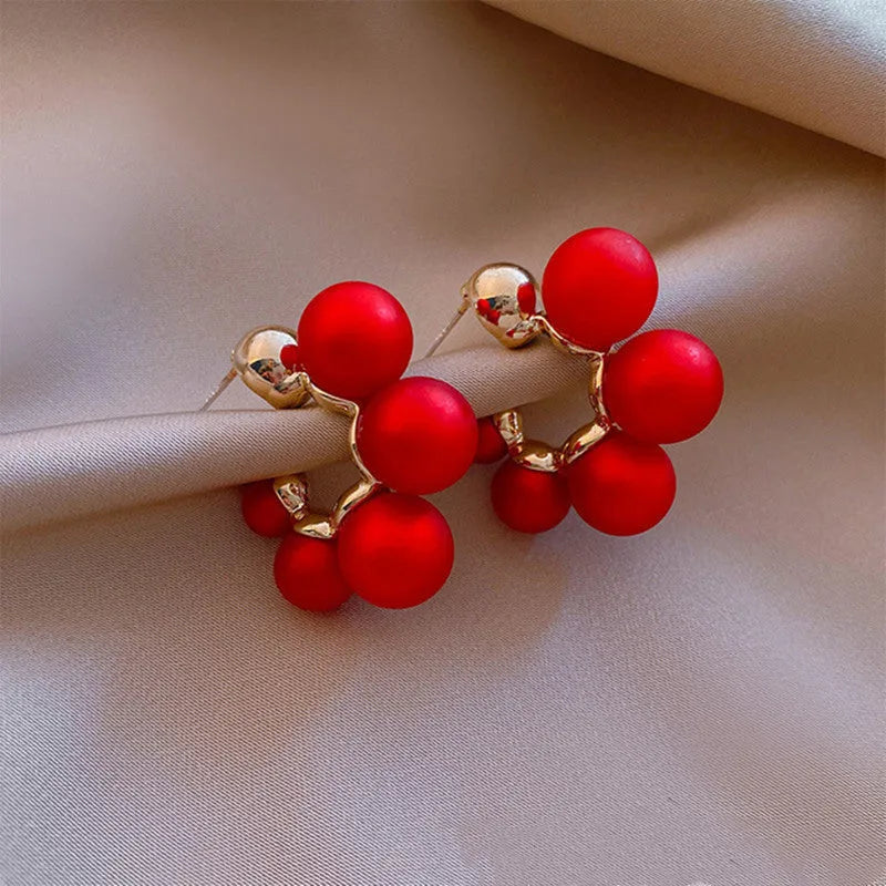 Red alloy bell-shaped drop earrings for women, showing 2.5cm length.
