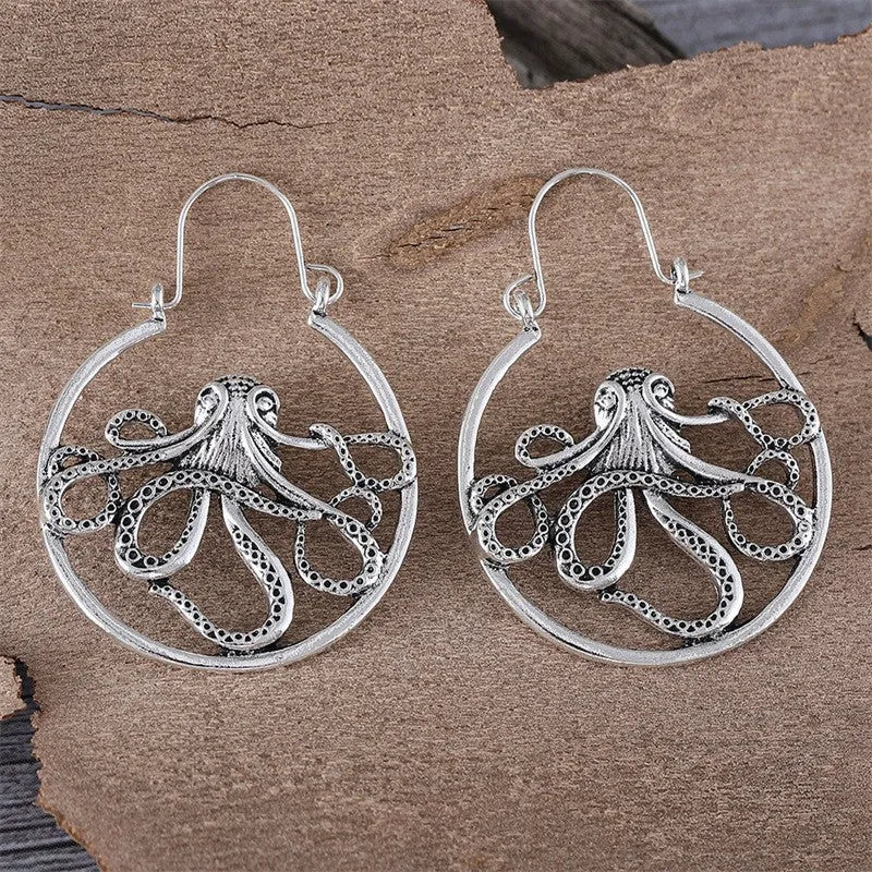 Close-up of vintage-style octopus earrings in antique silver colour with zinc alloy construction.