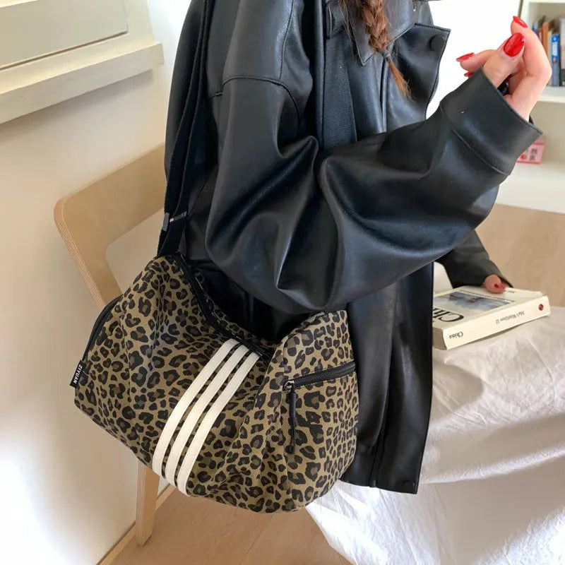 Large capacity leopard print sports style shoulder messenger bag made from cloth material with breathable and wear-resistant construction, suitable for daily use with neutral unisex design featuring fashionable stitching and burden-reducing function