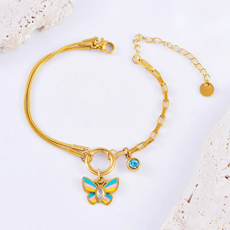 Gold titanium steel jewellery set with colourful epoxy butterfly pendant necklace and matching bracelet
