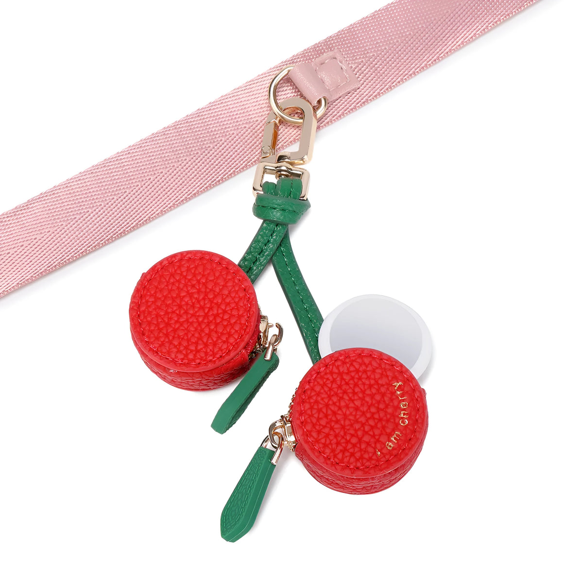 Small solid colour PU leather keychain coin bag in cherry, blueberry, or orange.