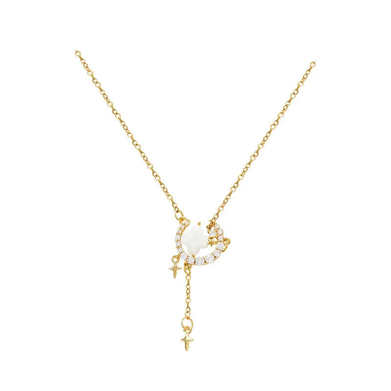 Women's sparking zirconium necklace showing star and moon pendant on adjustable chain