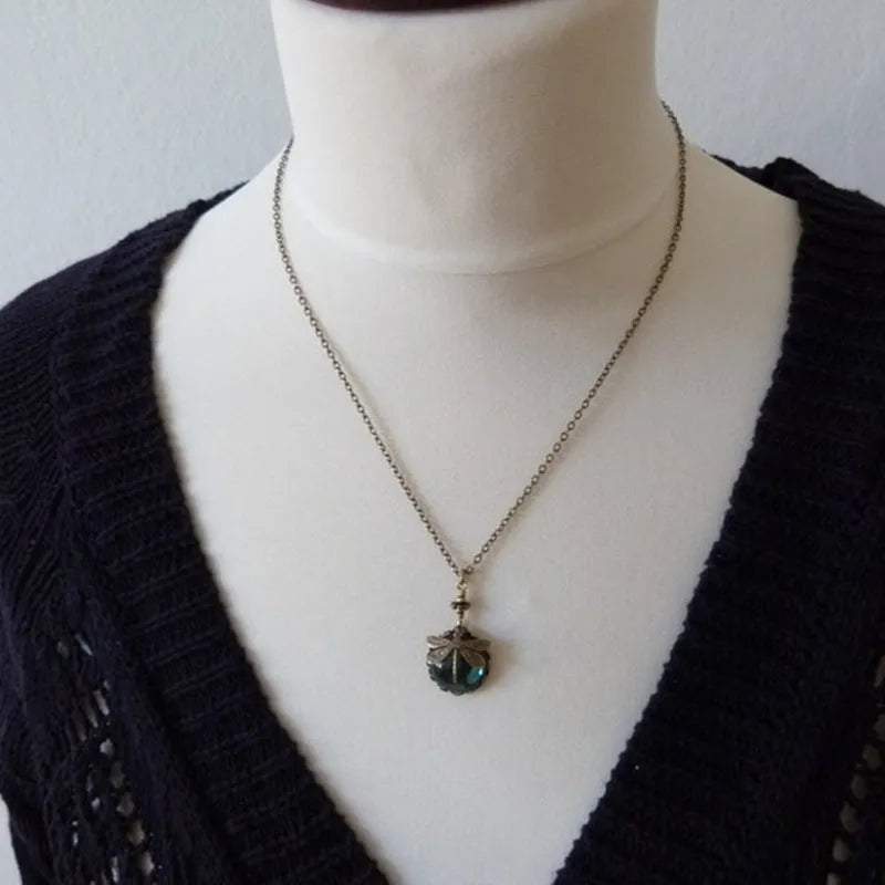 Vintage bronze dragonfly pendant necklace on a chain, yellow finish, pastoral style.