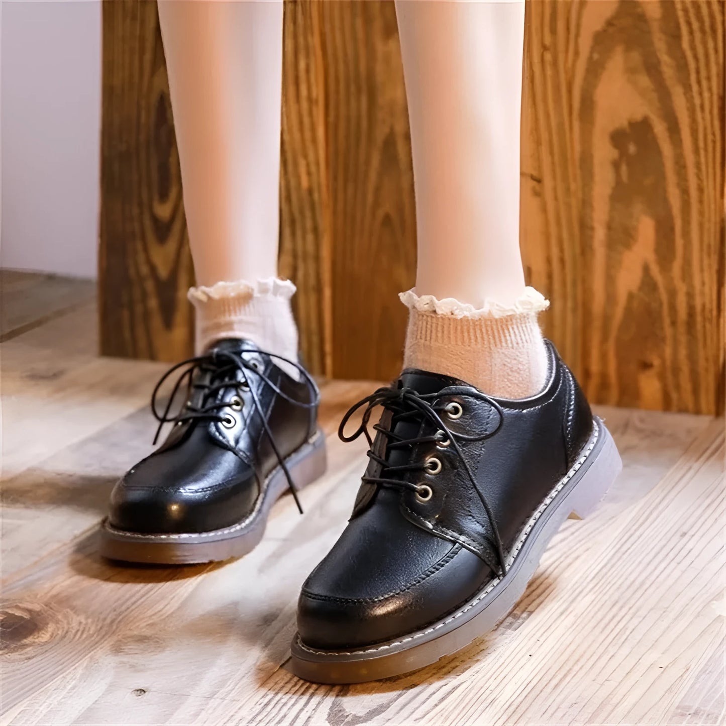 Black retro women's Mary Jane pumps with a low square heel and front lace-up.