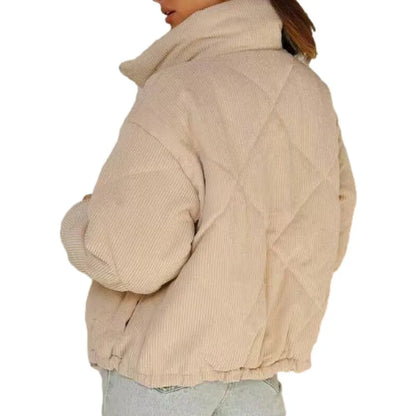 Apricot women's corduroy zip-up jacket with a stand collar and long sleeves on a hanger.