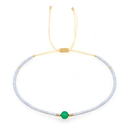 Handmade women's bracelet with colourful geometric glass and coloured glaze beads in Bohemian style.