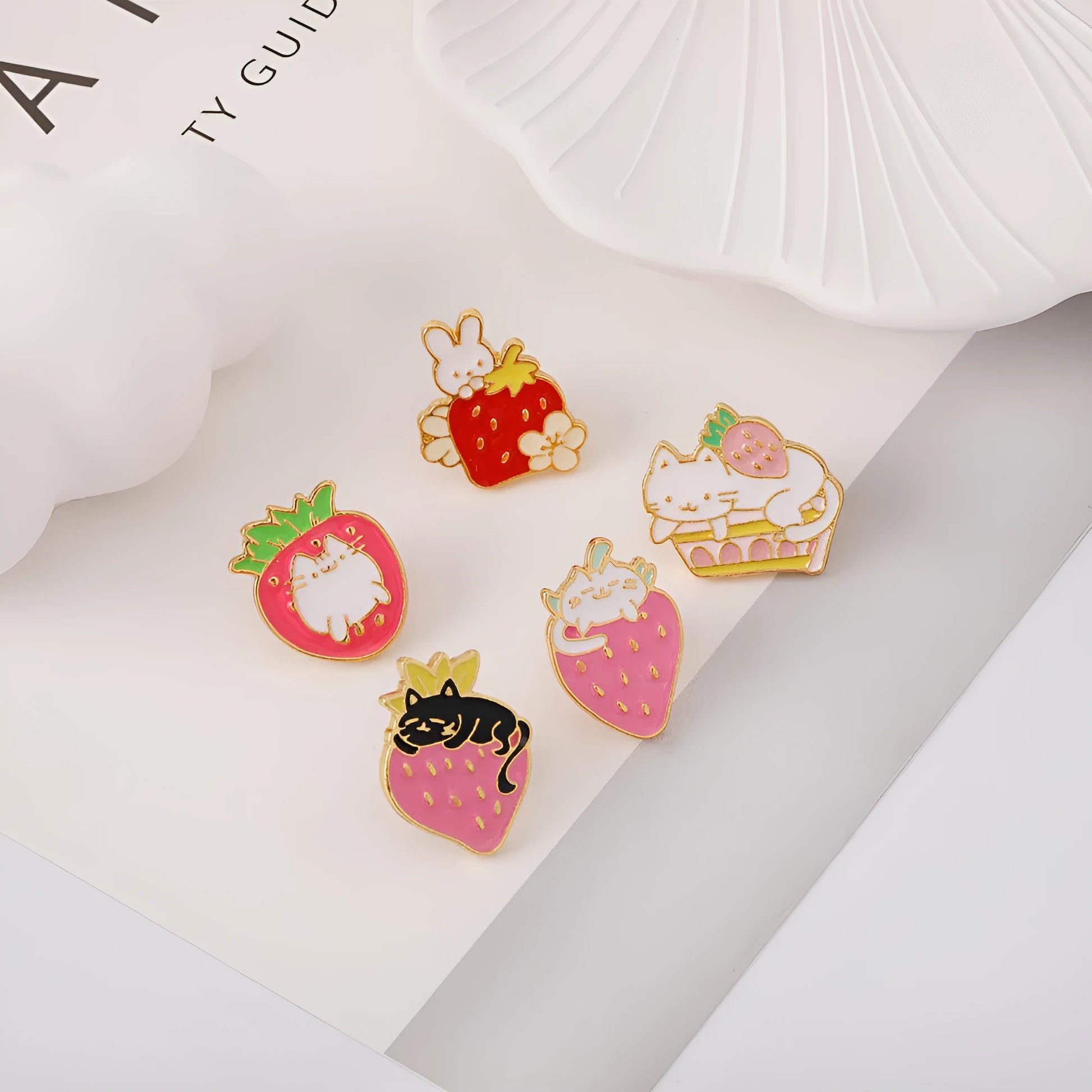 Close-up of a cute cat strawberry and dripping cake oil design metal alloy brooch pin.