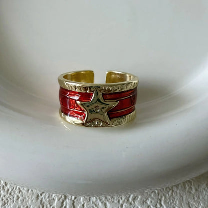 Geometric drop oil women's ring with adjustable band in distressed electroplated finish.