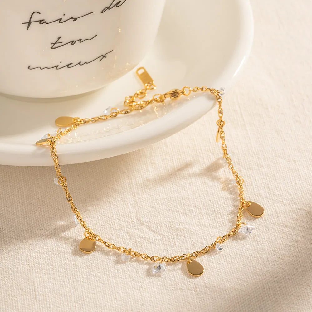 Stainless steel water drop tassel anklet with geometric shapes and adjustable chain