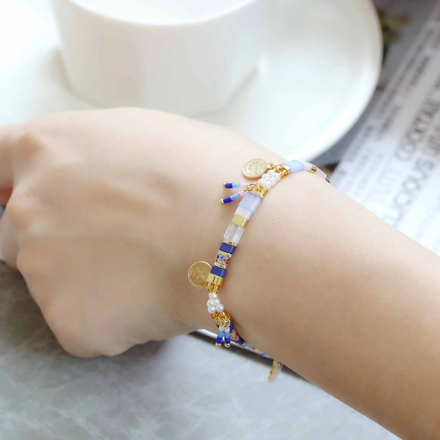 Women's handcrafted bracelet with imitation pearl and coloured glass beads in one of six colour styles.