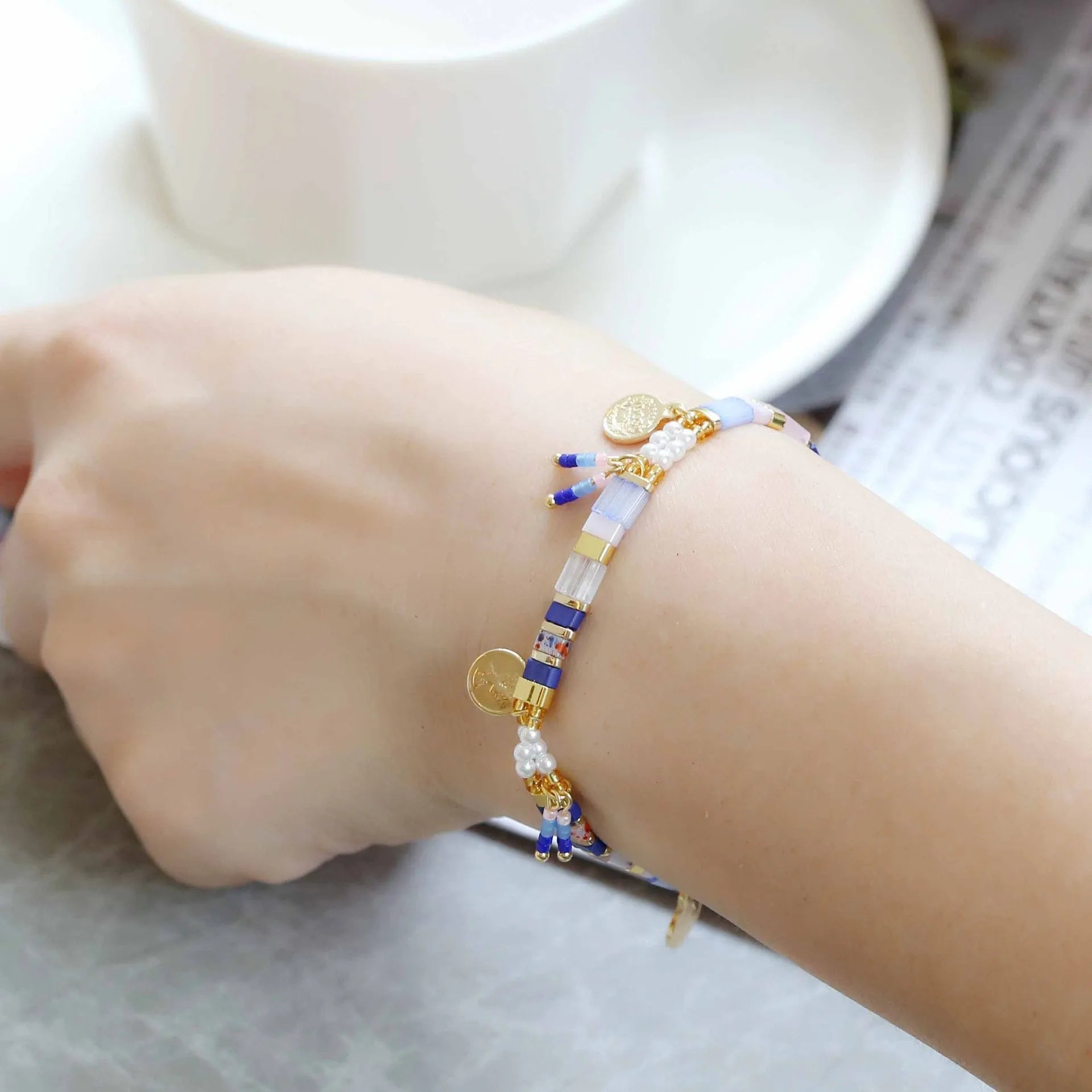 Women's handcrafted bracelet with imitation pearl and coloured glass beads in one of six colour styles.