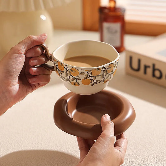 Antique-style ceramic coffee cup and saucer set with 210ml capacity in black or orange medieval designs