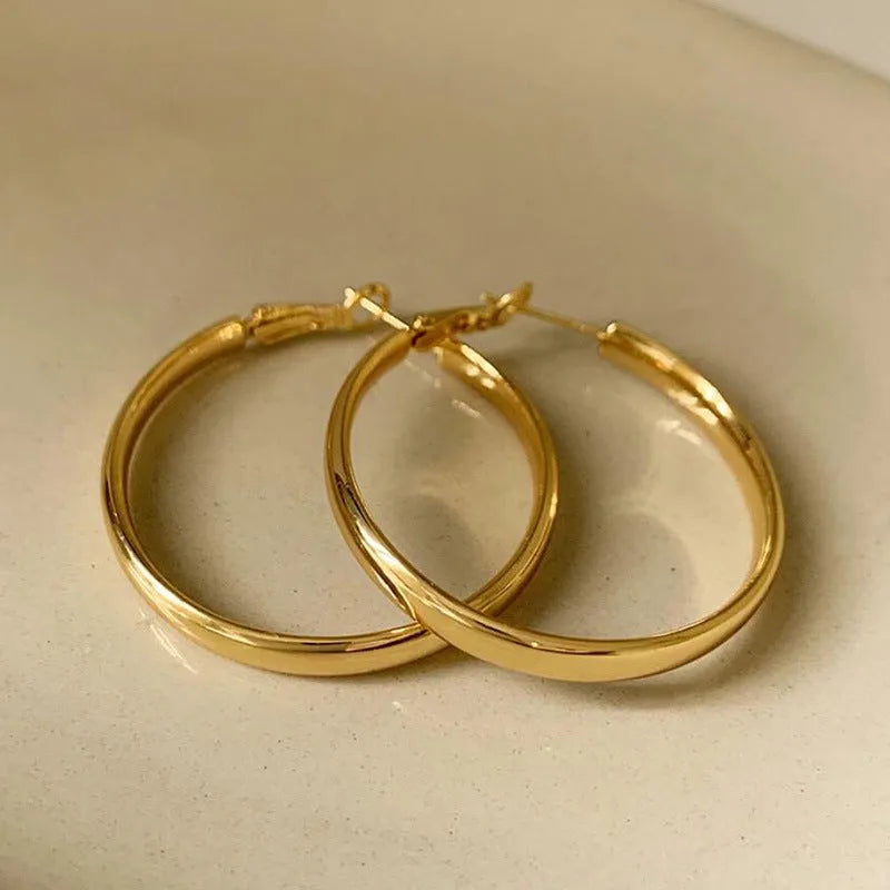 Gold and silver tone 40mm metal circle earrings with electroplated finish