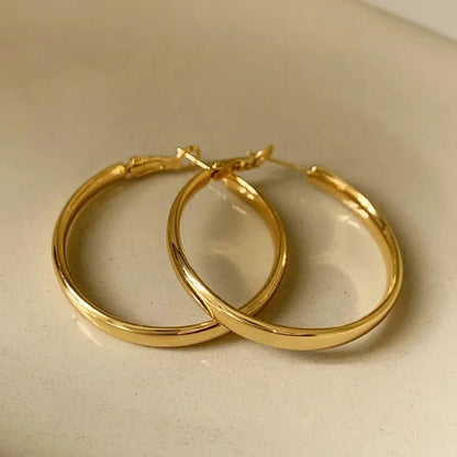 Gold and silver tone 40mm metal circle earrings with electroplated finish