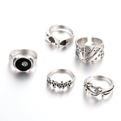 Adjustable black alloy ring with a large raised poker spade motif on a finger.