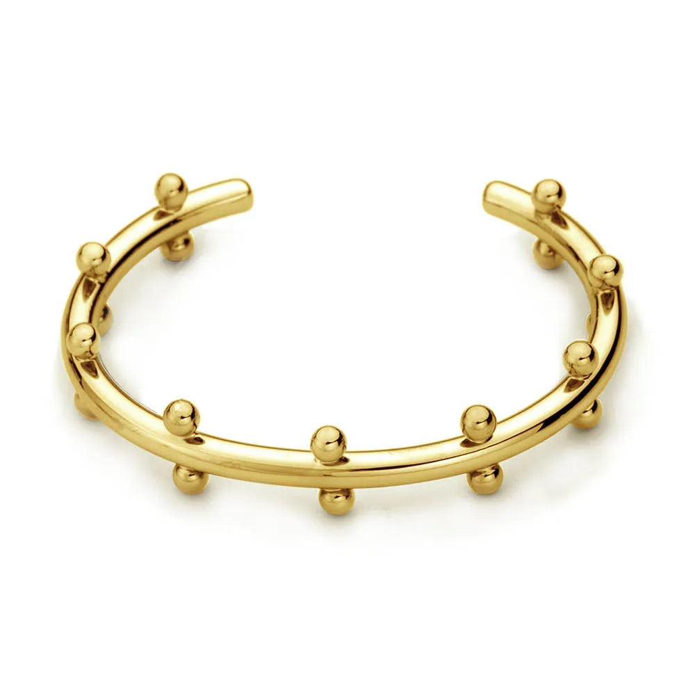 C-shaped stainless steel bracelet with textured rivets and bean beads in gold finish