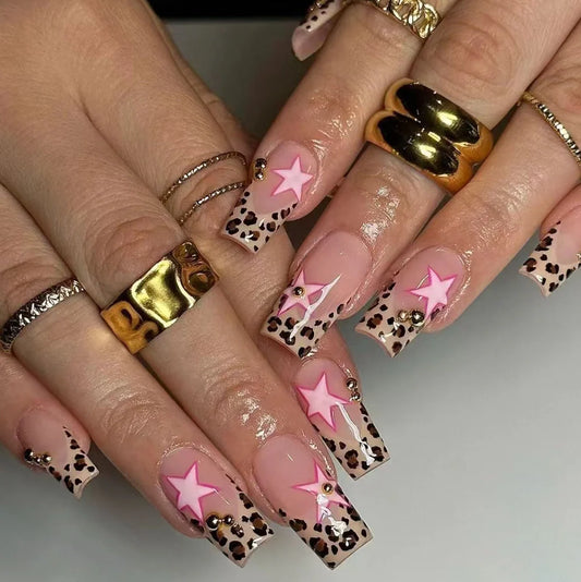 French leopard print manicure set with five-pointed stars and pearl diamond accents on nails