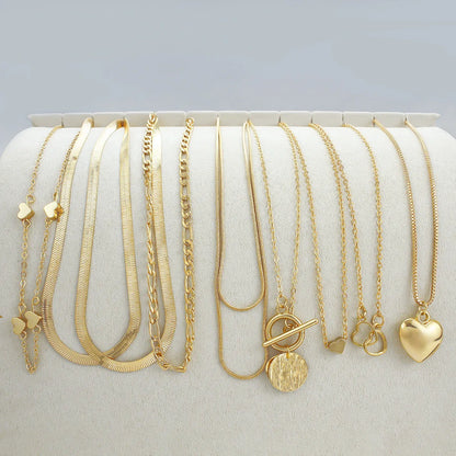 10 gold necklaces with adjustable chains from 21cm to 50cm, featuring electroplated alloy pendants on snake bone chains