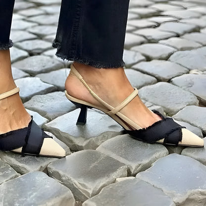Apricot and black colour-block women's stiletto sandals with a buckle and pointed toe.