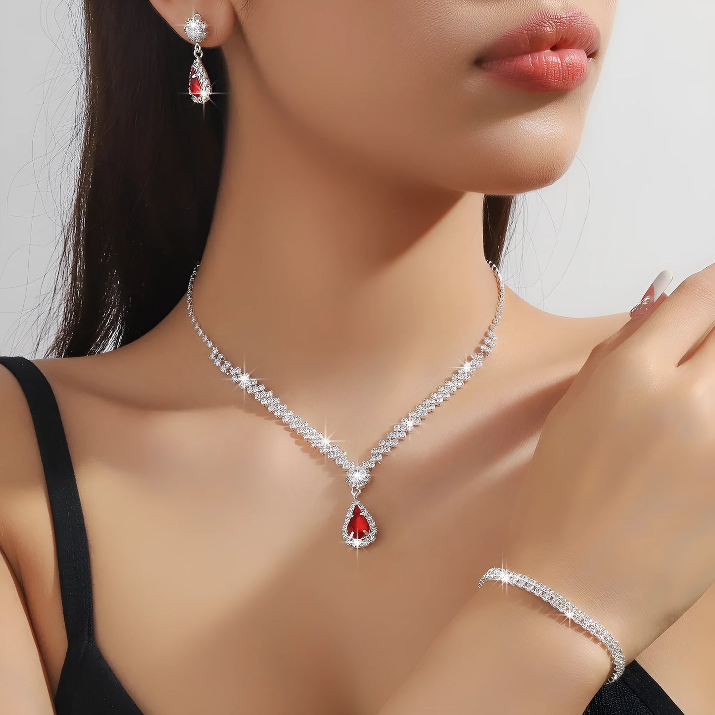 Rhinestone claw chain necklace and earrings set with water drop shaped pendants