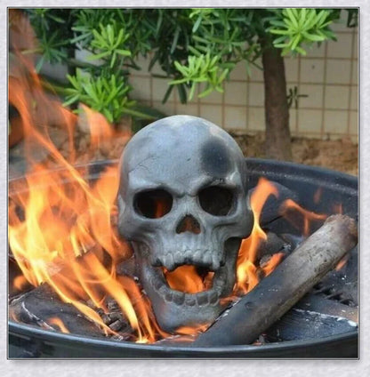 Terrifying human skull fire pit with flames escaping from the eyes and nose, perfect for outdoor gatherings and Halloween celebrations