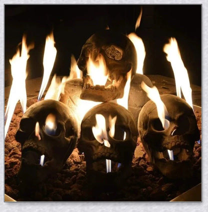 Terrifying human skull fire pit with flames escaping from the eyes and nose, perfect for outdoor gatherings and Halloween celebrations