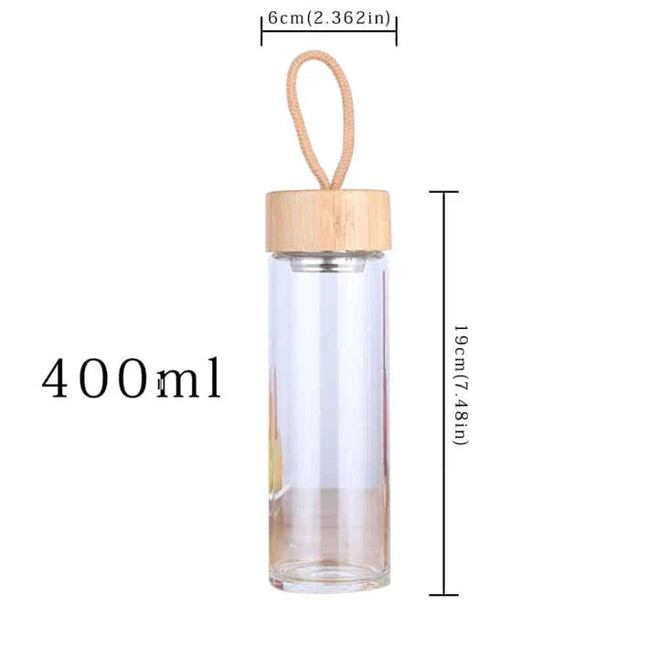 Elegant glass water bottle with bamboo lid and string, a sustainable and fashionable hydration solution
