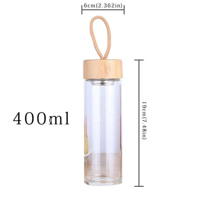 Elegant glass water bottle with bamboo lid and string, a sustainable and fashionable hydration solution