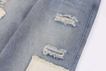 A pair of premium American-style distressed jeans with a straight-leg design and heavy-duty denim construction