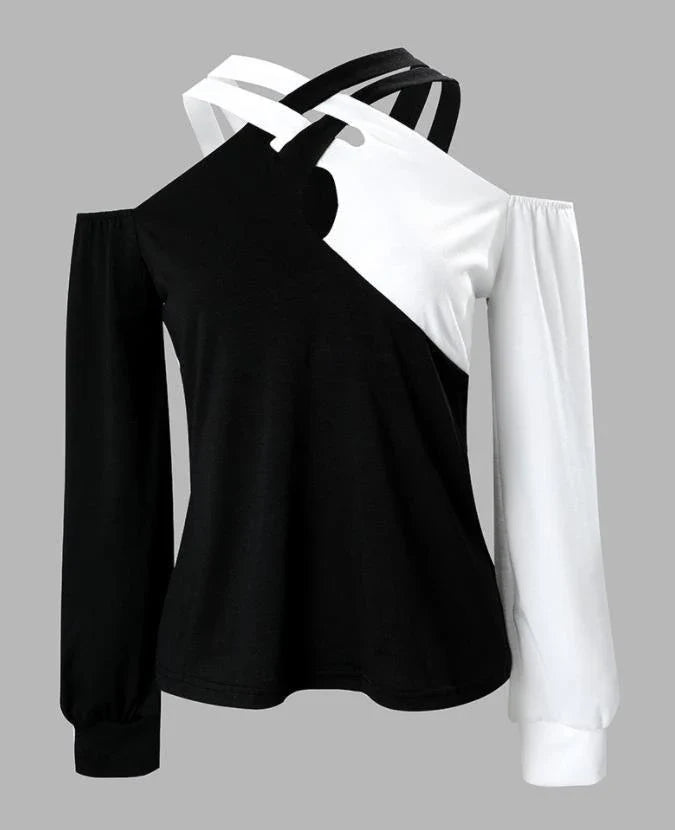 A stylish women's top with a black and white patchwork design, featuring a cross-belt accent for a fashionable casual look.