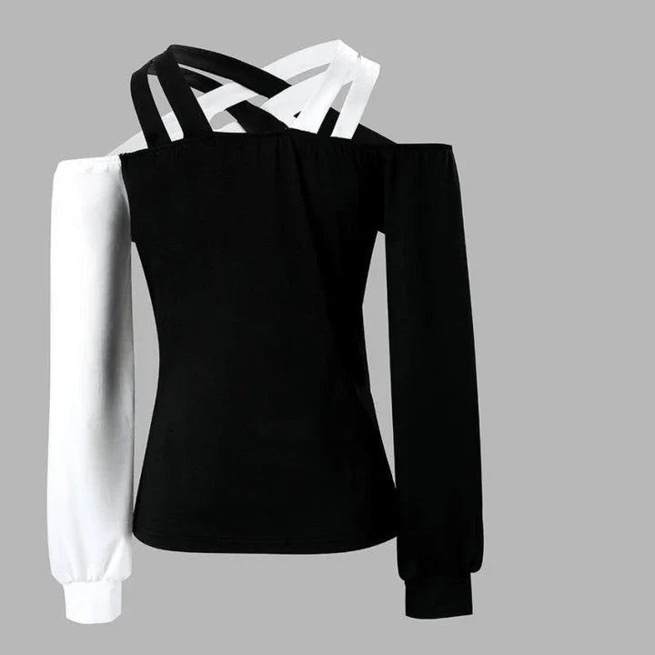 A stylish women's top with a black and white patchwork design, featuring a cross-belt accent for a fashionable casual look.
